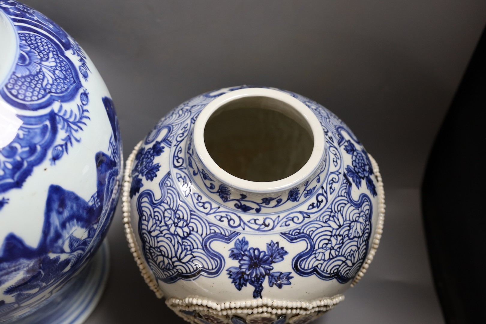 A large Chinese blue and white jar and cover and a blue and white jar and cover, 19th-century and later. Largest 44cm